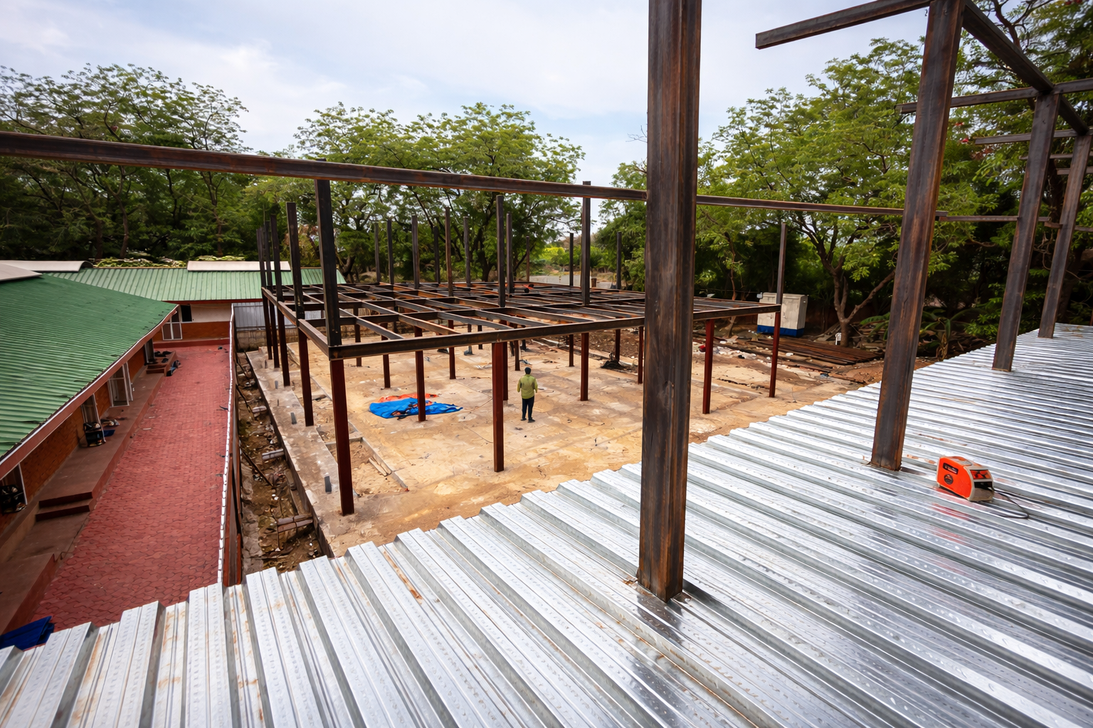 Steel framework rising at construction site